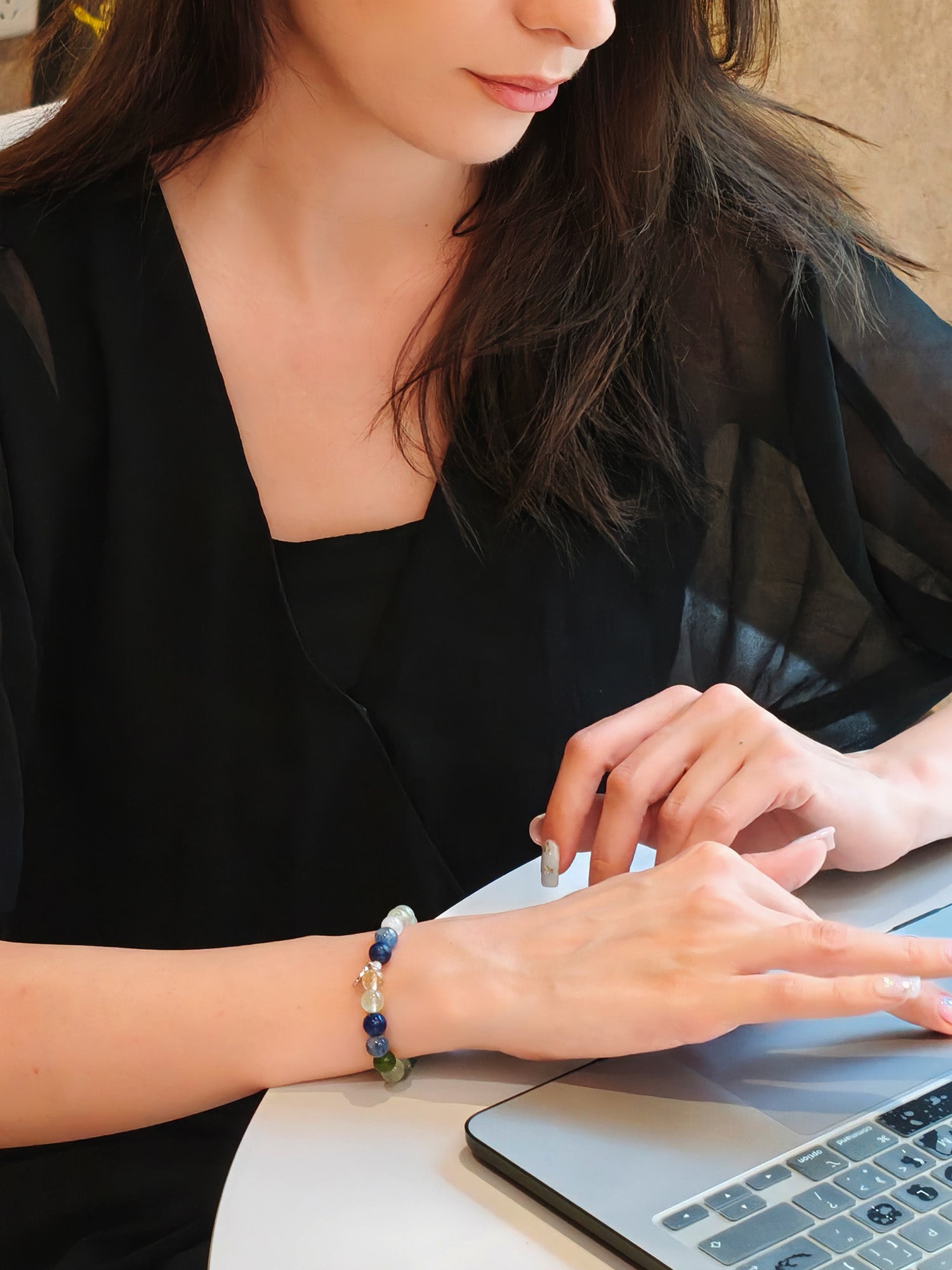 Lifestyle shot of woman with natural crystal bracelet for harmony