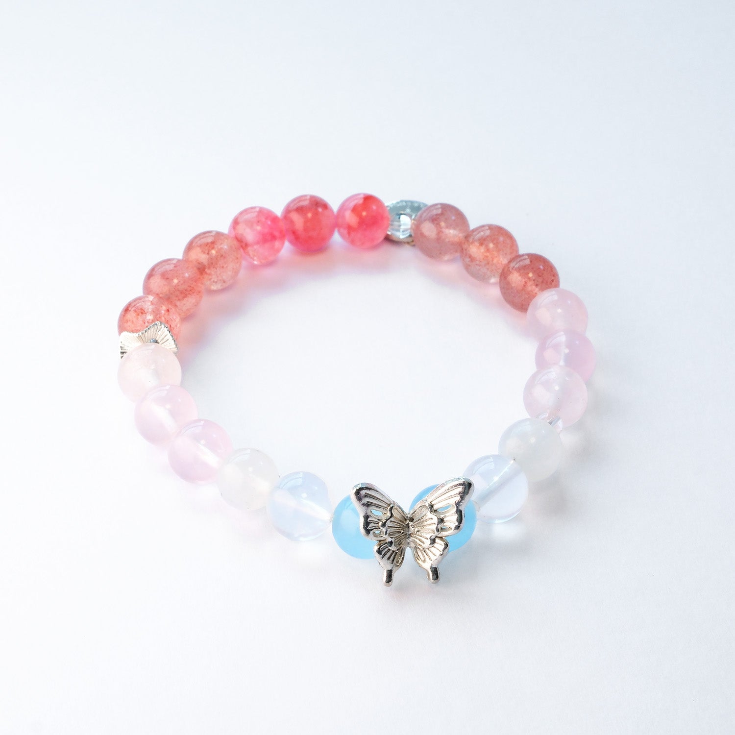 Butterfly Nebula bracelet collection with silver butterfly accents in  pink