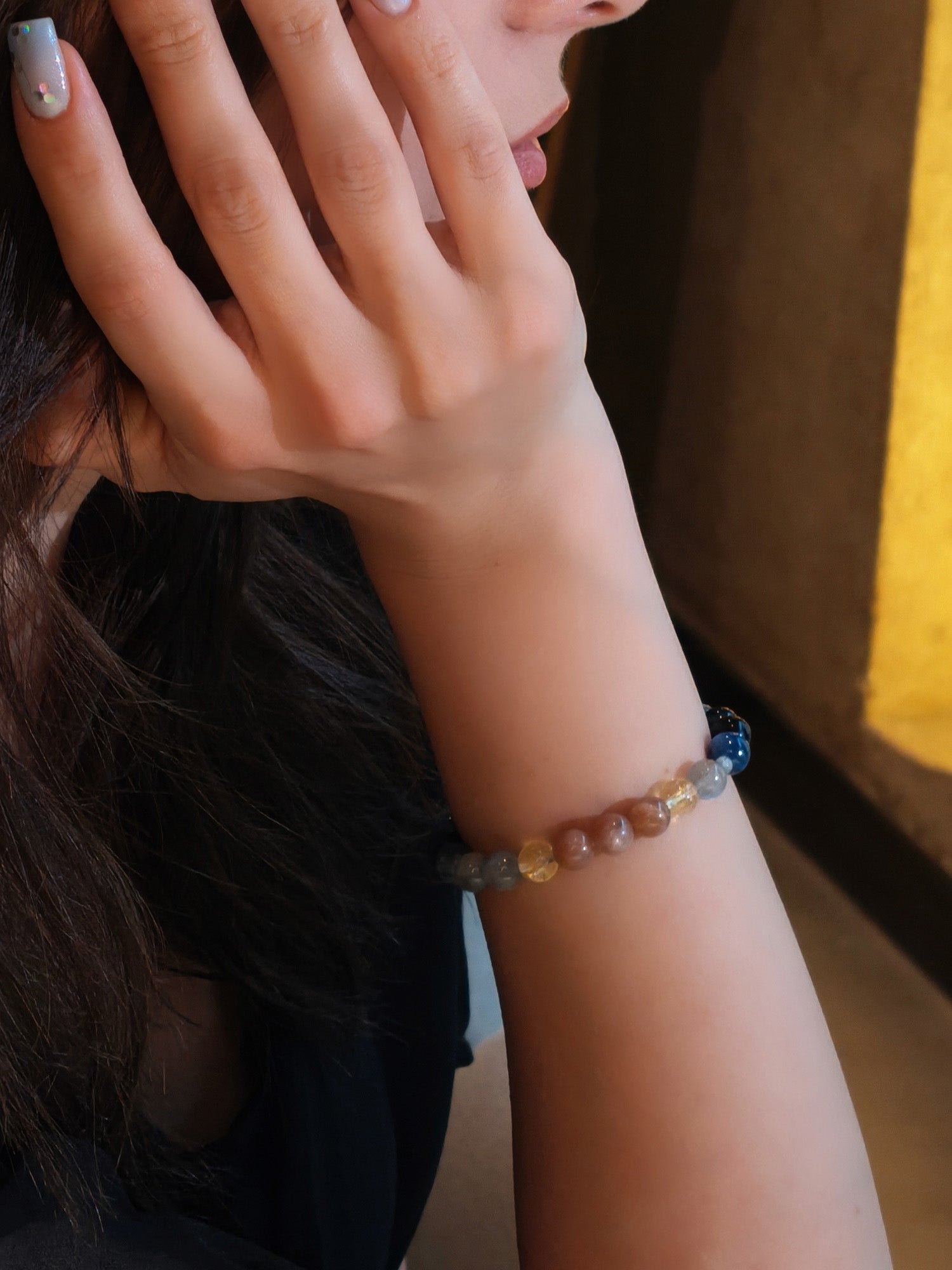 Woman wearing crystal bracelet for strength and transformation