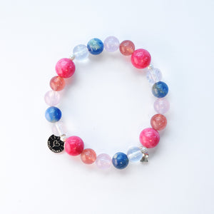 Close-up of kyanite and rose quartz crystal bracelet for harmony and renewal