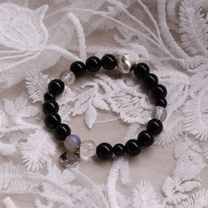 New Moon bracelet with obsidian and clear quartz, minimalist crystal jewellery for renewal and focus