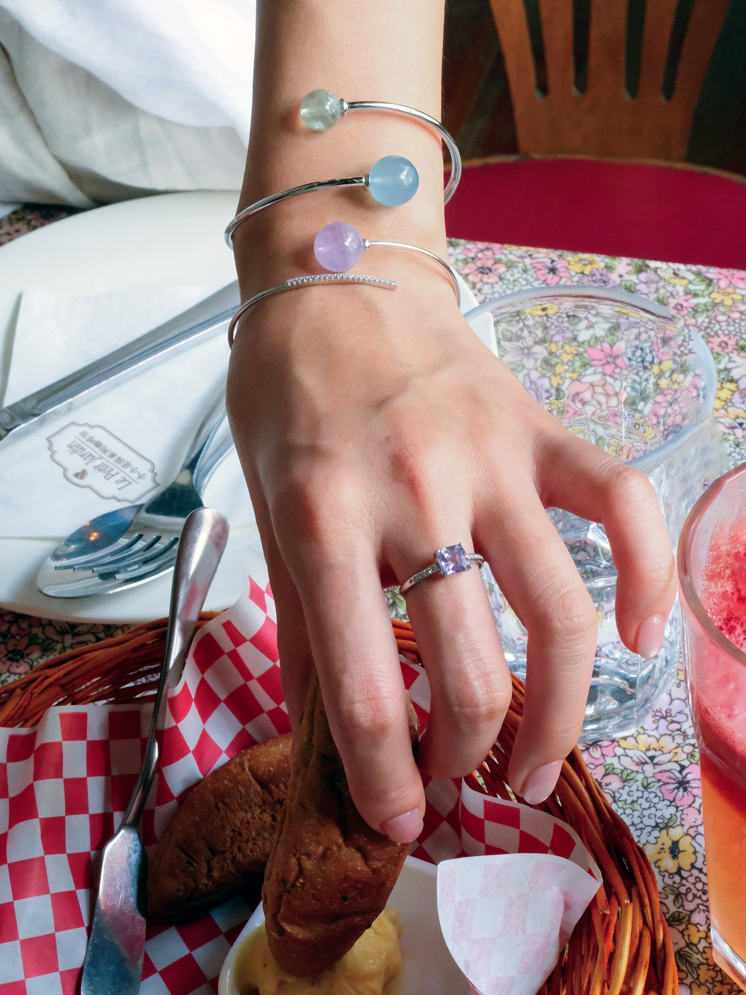 girl wearing lavender amethyst ring, sterling silver bracelet with aquamarine and prehite natural crystal. Sterling silver amethyst ring, ideal holiday gift for spiritual seekers