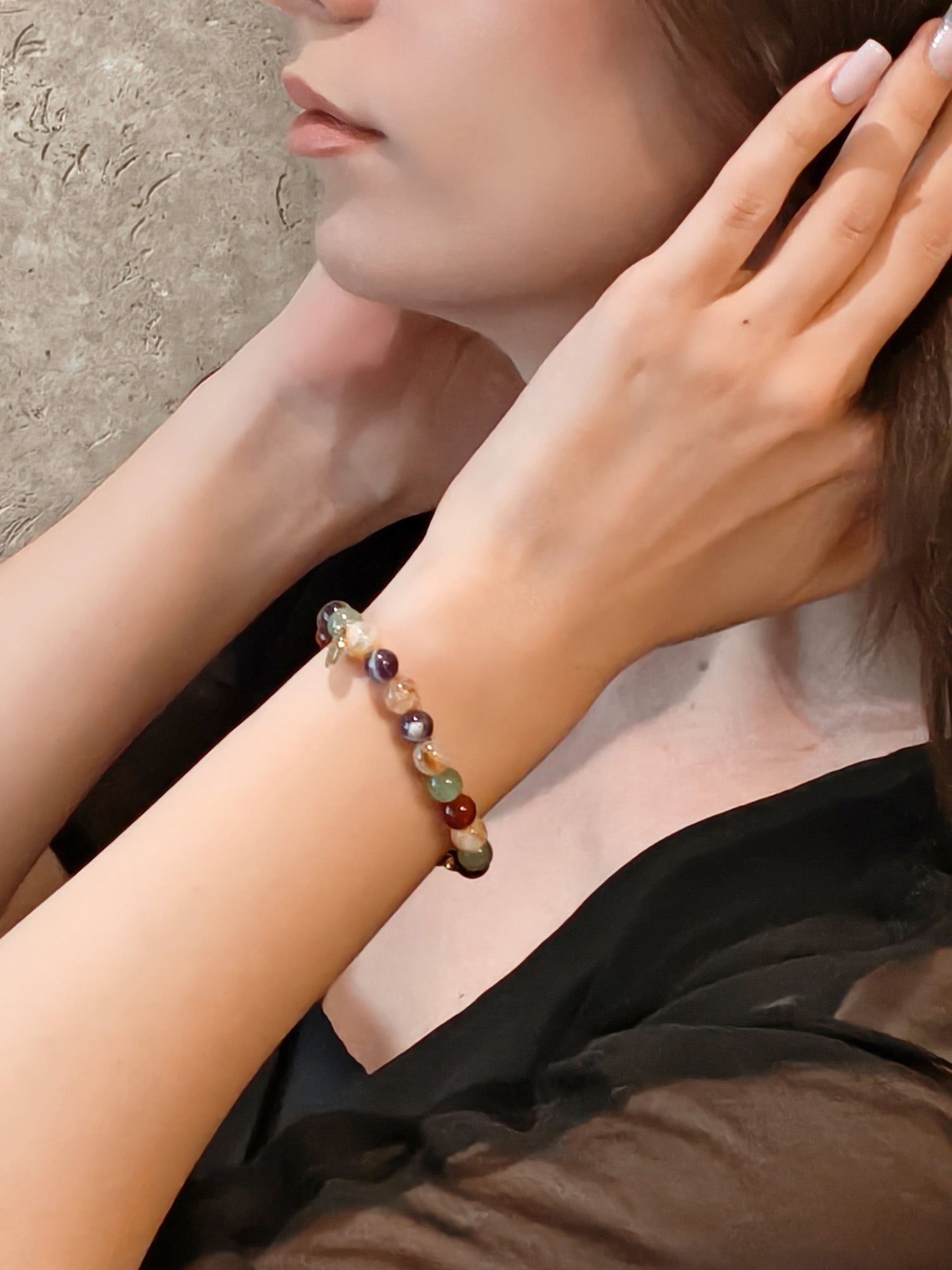 Woman wearing crystal bracelet for protection and emotional balance