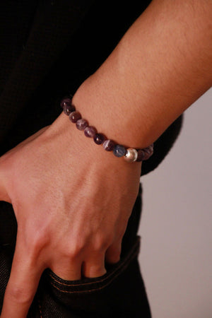 Waning Gibbous crystal bracelet worn on wrist, cool-toned gemstone jewellery